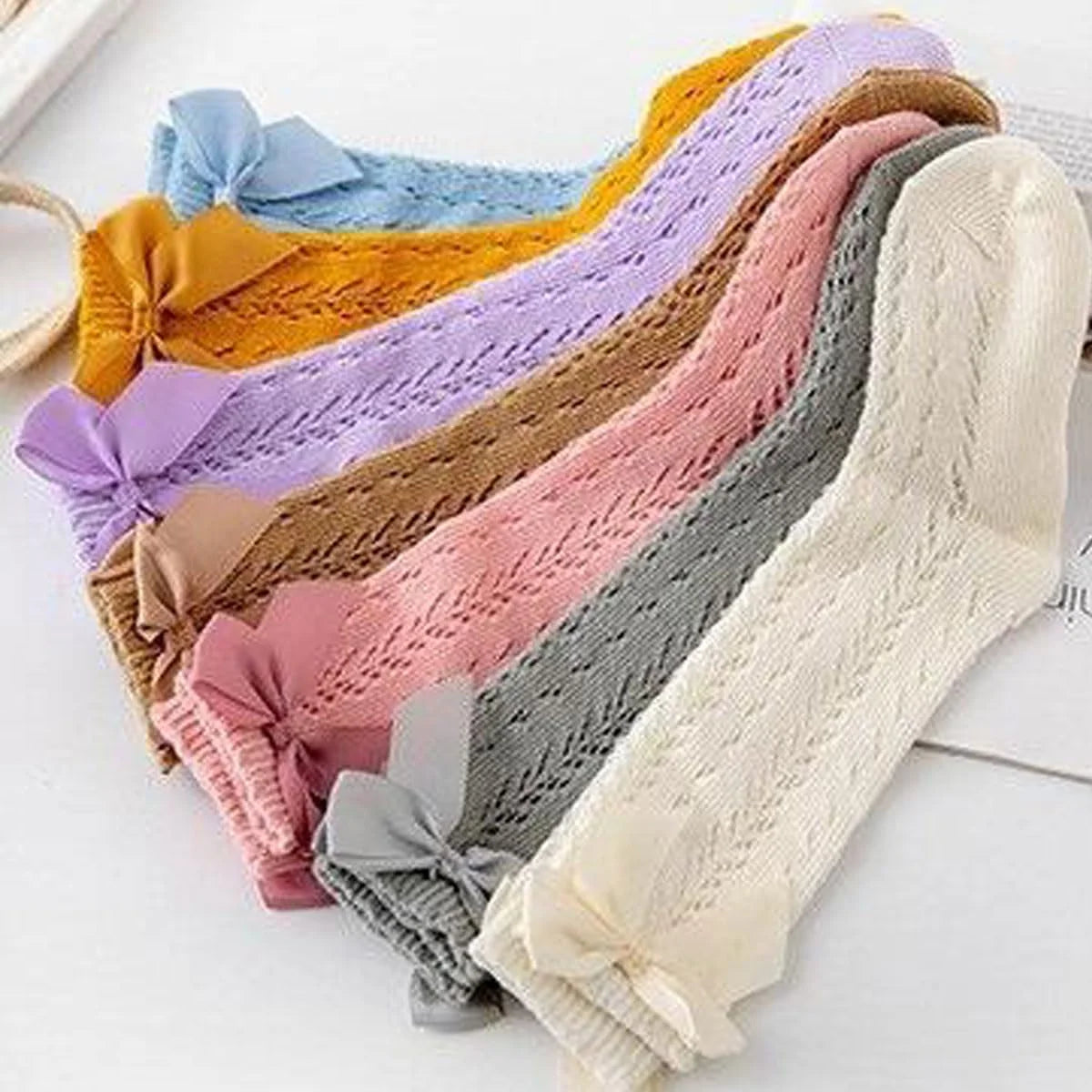 FZBNSRKO 7 Pairs Baby Knee High Socks,Cotton High Socks with Bow,Hollow Girl Dress Socks For Toddlers Newborn(Random Color)